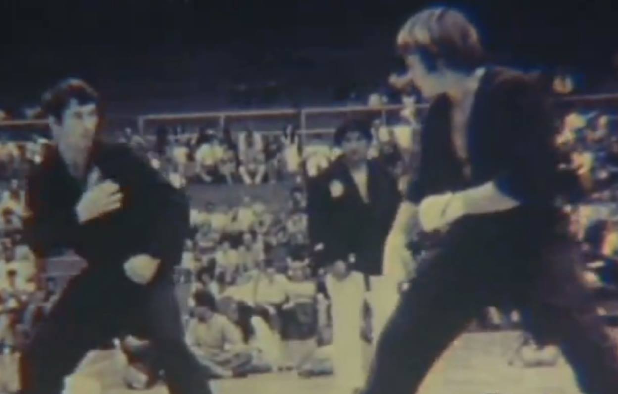  Bill Wallace and Joe Lewis sparring with Daniel Pai the referee. 